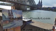 Mark N Brown working by the Hohenzollern Bridge overlooking the cathedral